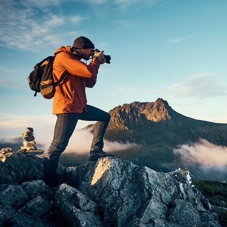 Fotograf auf Berggipfel